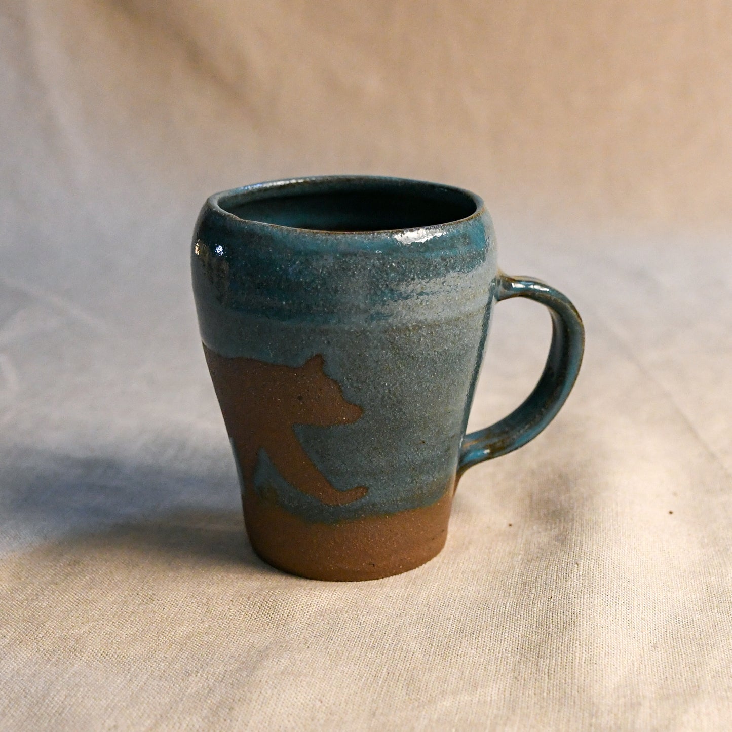 Wild Rojo 5-mug set in sage green with 5 original designs of a bison, elk, aztec, wolf, and bears.