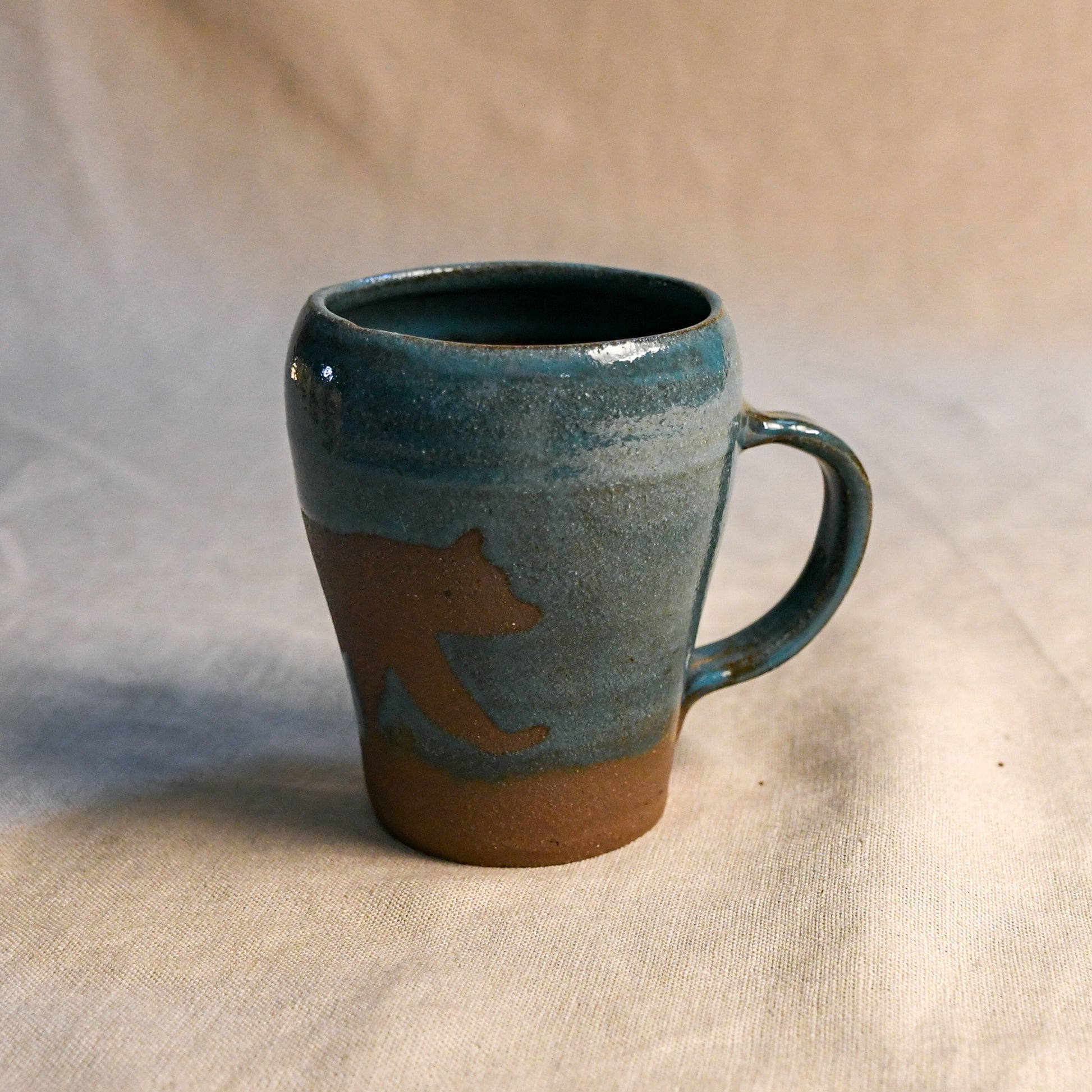Wild Rojo 5-mug set in sage green with 5 original designs of a bison, elk, aztec, wolf, and bears.