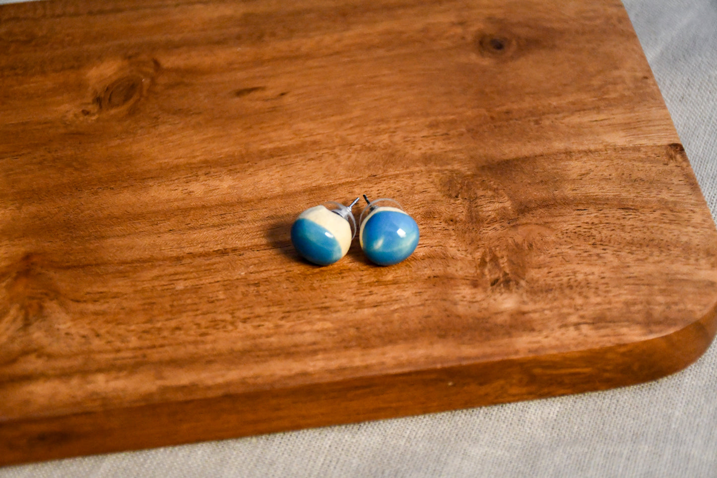 Handmade round ceramic stud earrings by Leigh Art.