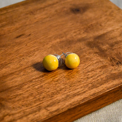Handmade round ceramic stud earrings by Leigh Art.