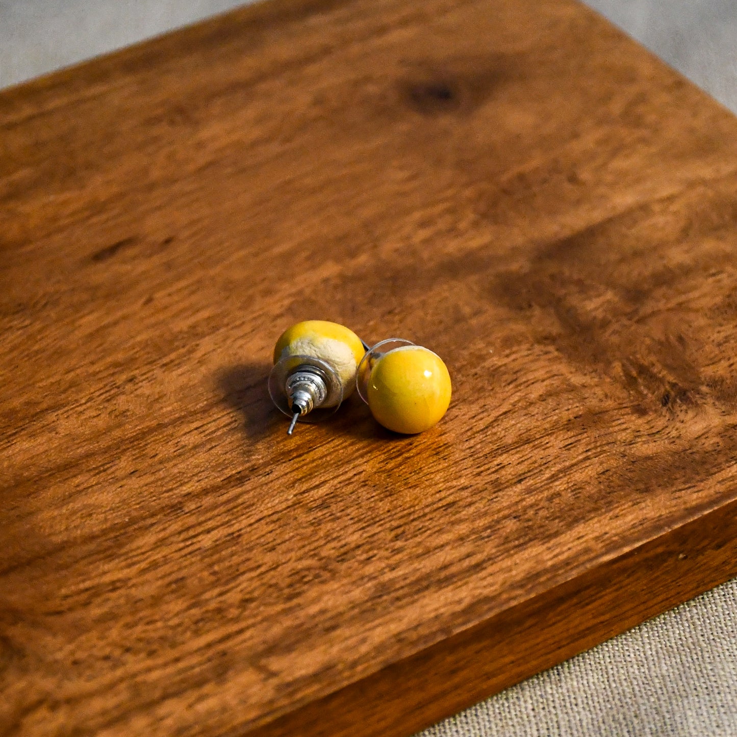 Handmade round ceramic stud earrings by Leigh Art.