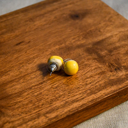 Handmade round ceramic stud earrings by Leigh Art.