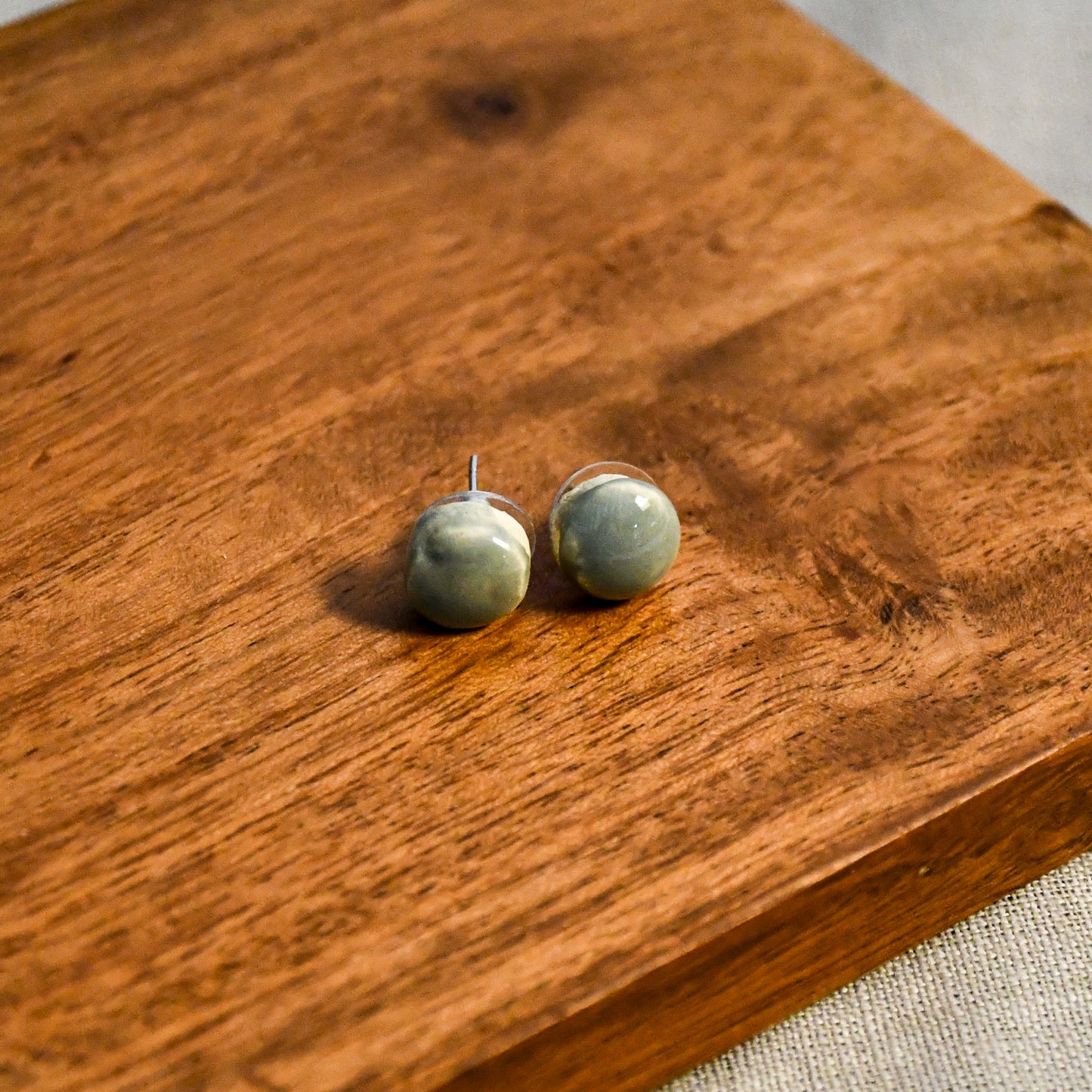 Handmade round ceramic stud earrings by Leigh Art.
