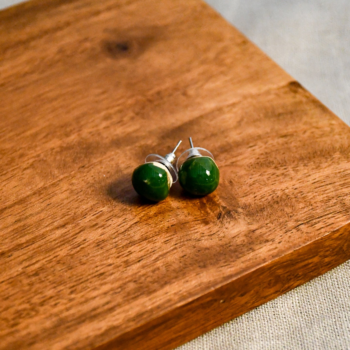 Handmade round ceramic stud earrings by Leigh Art.