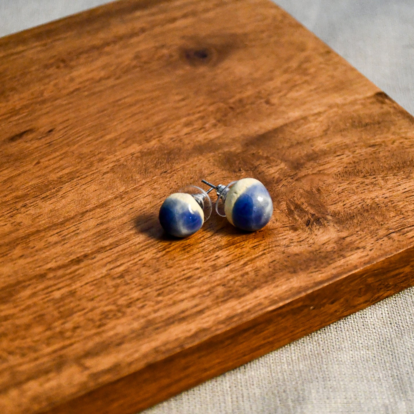Handmade round ceramic stud earrings by Leigh Art.