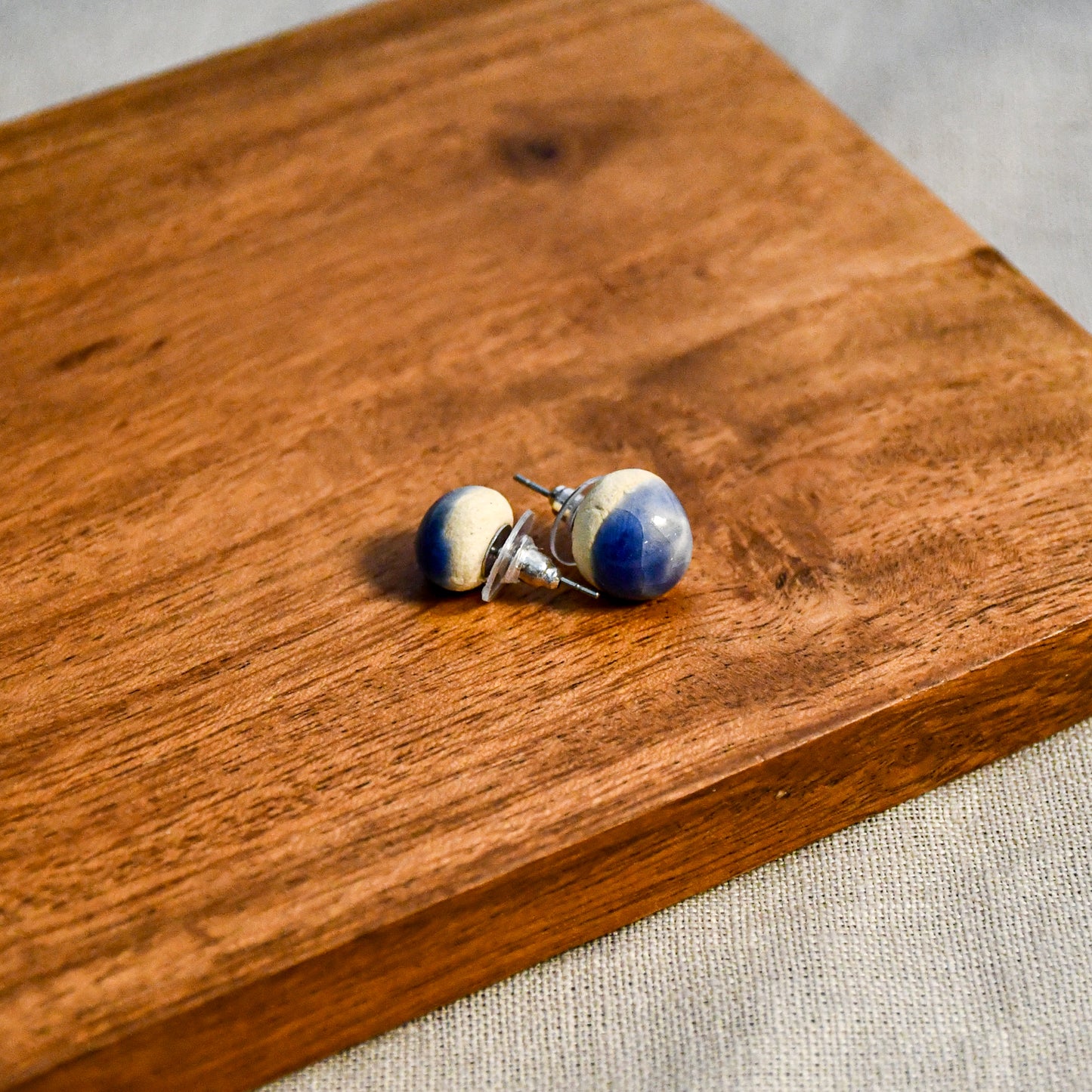 Handmade round ceramic stud earrings by Leigh Art.