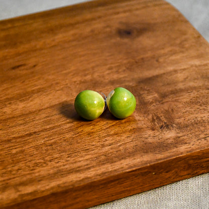 Handmade round ceramic stud earrings by Leigh Art.