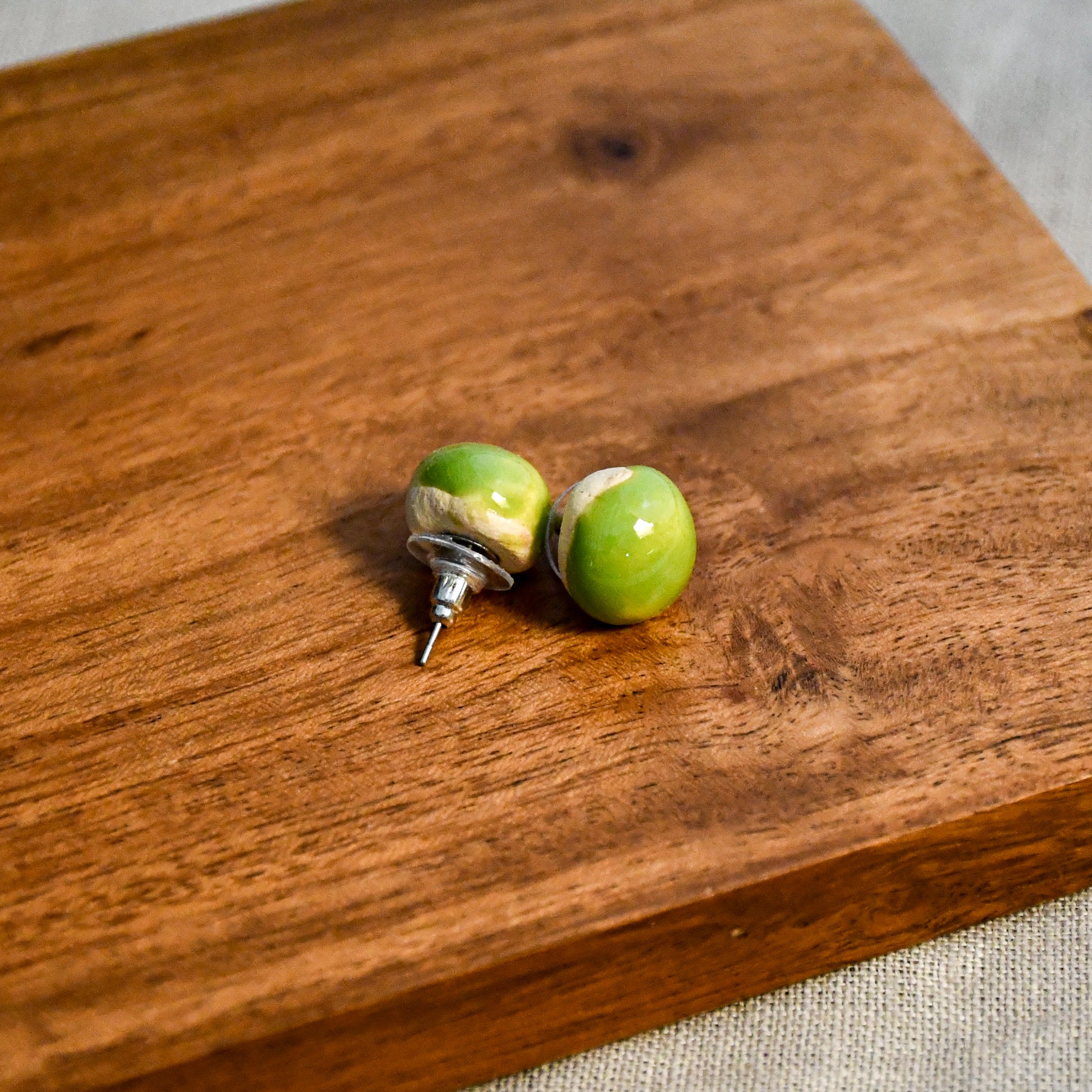 Handmade round ceramic stud earrings by Leigh Art.