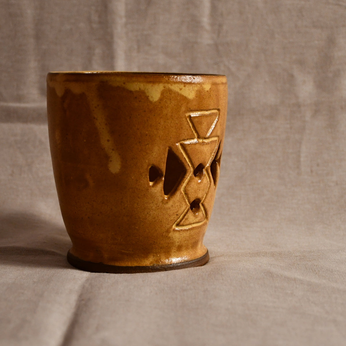 Side profile of hand carved ceramic lantern, handmade in Texas